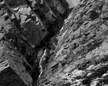 "Snowmelt's Path" - Melting snow finds its way down to ground level on a hot June day through the Pinnacle Gully on the headwall of Huntington Ravine on Mt. Washington, NH.