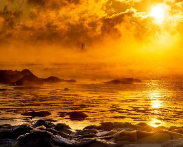 "Emergence" - Whaleback Lighthouse in Kittery, ME, during a sunrise "sea smoke" event.