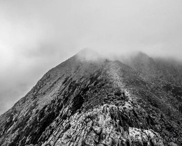 "Emerging" - A hiker emerges from the clouds on Mt. Katahdin's Knife Edge.