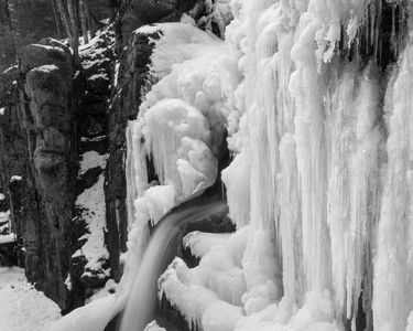 "Sparkle and Flow" - The frozen walls encasing Avalanche Falls in Franconia Notch, NH in winter.