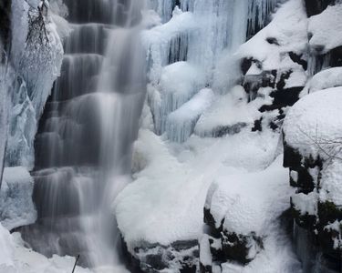 Hawthorne Falls, an off-trail waterfall on Mt. Garfield in the White Mountains of New Hampshire, in shoulder season.