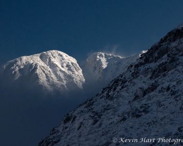 "Presence" - The sun lights up the Knife Edge on Katahdin which rises up above a layer of fog. Maine.