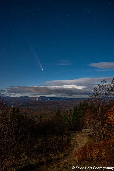 The long tail of a comet is seen over southeast Vermont.