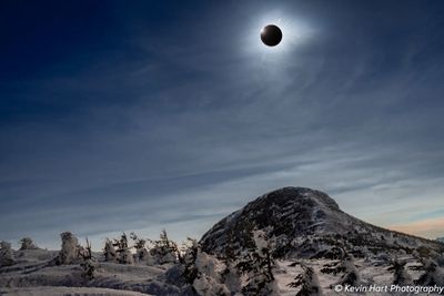 "Moon over Vermont" - The 2024 Solar Eclipse hangs over the Chin on Mt. Mansfield, Vermont's highest point, during totality.