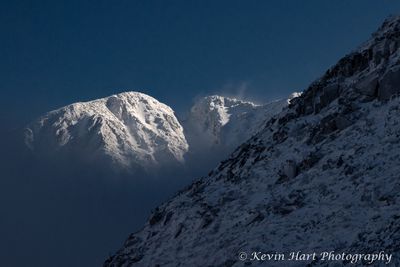 "Presence" - The sun lights up the Knife Edge on Katahdin which rises up above a layer of fog. Maine.