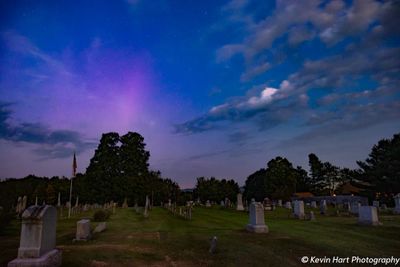 "Spirit Raiser" - An aurora substorm pops out above a cemetery in Morrisville, VT.