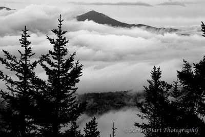 Whiteface Mountain (Vermont) pokes above the clouds one foggy morning as seen from Stowe Pinnacle.