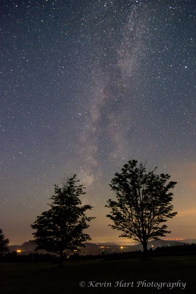 "Reach": Two trees reach for the Milky Way galaxy in Sentinel Rock State Park, Westmore, VT.