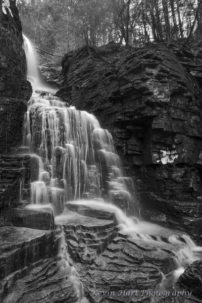A waterfall in Vermont in black and white.