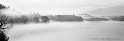 Fog over the Waterbury Dam in Vermont in black and white.