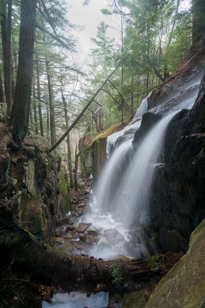 A double-veiled waterfall tumbles over a cliff wall in a "flume" on Vermont's Mt. Ascutney.